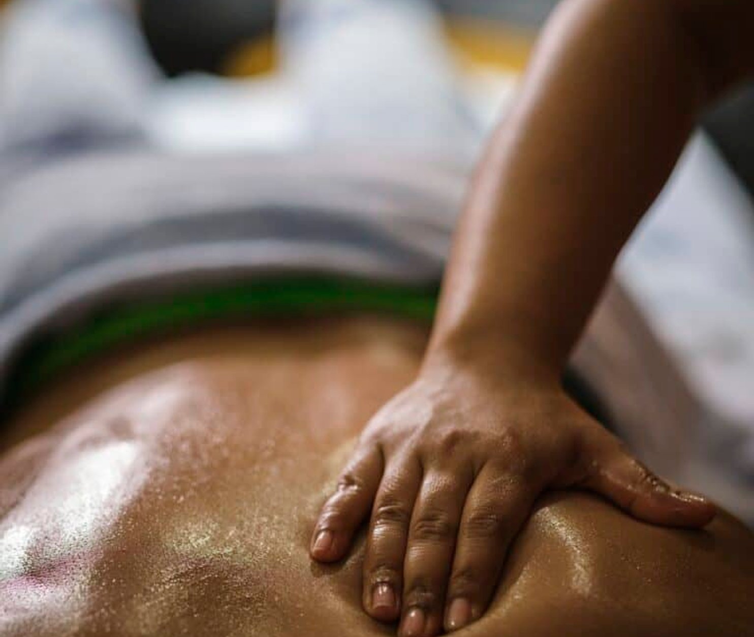 mens back getting a deep tissue massage