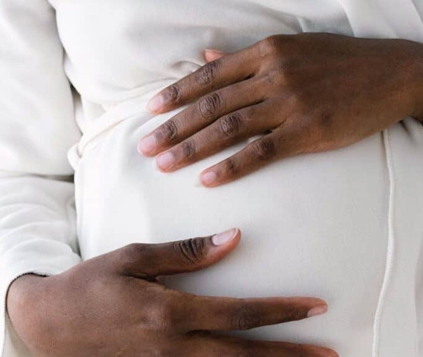 pregnant woman holding belly